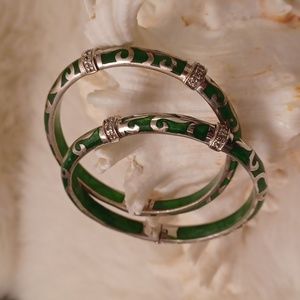 Pair Angeique de Paris resin and sterling bangles.